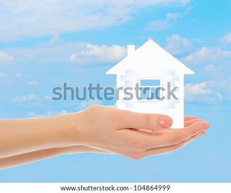 picture of a house in human hands