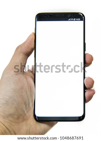 Mock up image of a hand holding white mobile smartphone with white screen in front of a white background.