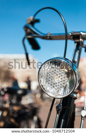 Close-up of the Headlight of a black Retro Bicycle