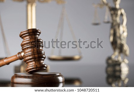 Law symbols on gray background.