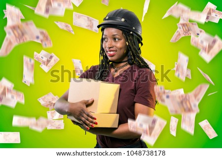 people, delivery, shipping, mail and moving concept - happy african american young woman holding cardboard boxes