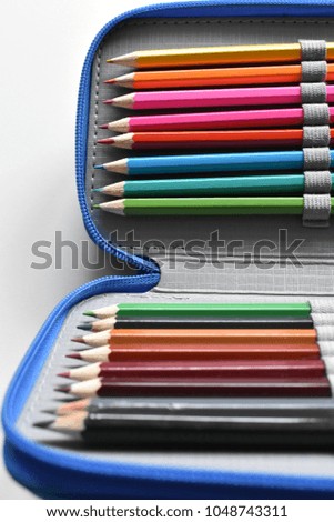Writing Case with Crayons on the white Background