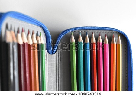 Writing Case with Crayons on the white Background