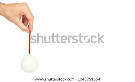 Cristmas decoration, glass ceramic white ball in hand isolated on white background. New Year object. copy space, template.