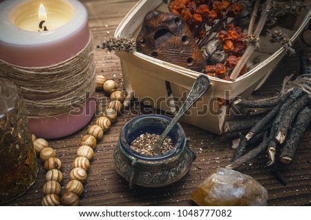 Magic potion. Alternative herbal medicine. Shaman table with copy space. Druidism concept. Witch doctor desk background. Royalty-Free Stock Photo #1048777082
