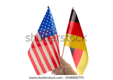 Germany and USA flag in hand as friendship concept
