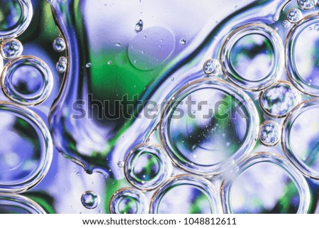 Drops of water on the surface of the oil