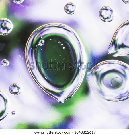 Drops of water on the surface of the oil