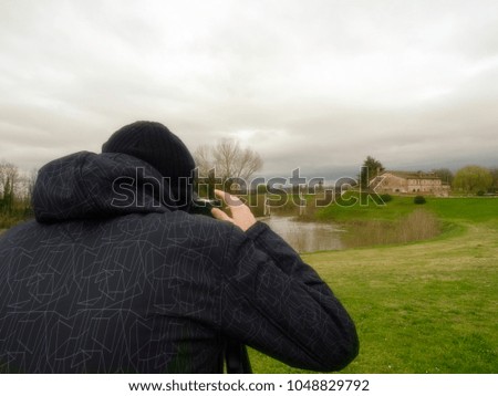 March 2018.Young man while taking a picture. Santa Maria di Veggiano, Padua Italy
