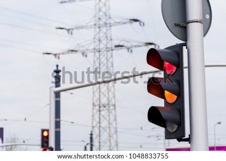 Red and yellow color of traffic light on road