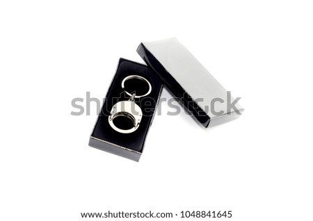 New keychain on keys in a black box on a white background close-up