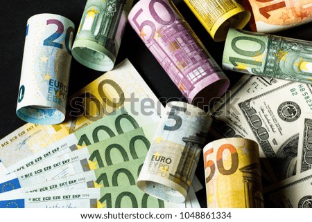 Concept of currency exchange trading. . Roll of Hundred us dollar bills .