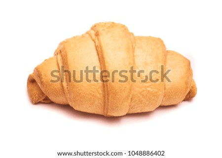 freshly baked tasty croissant isolated on white