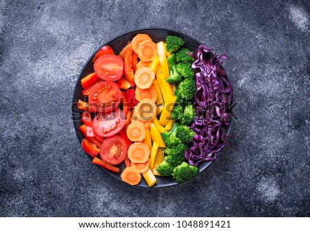 Fresh healthy vegetarian rainbow salad. Top view Royalty-Free Stock Photo #1048891421