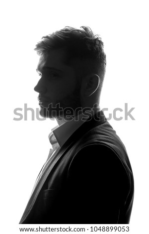 Unknown silhouette of caucasian man portrait profile in suit. Isolated white background.