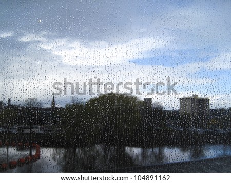 River Calder, Wakefield, Yorkshire through a rain-splatted window