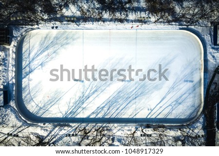 aerial view of empty hockey skate rink on a winter sunny day