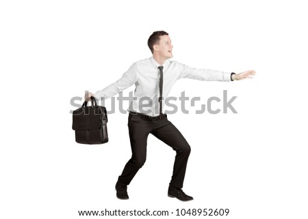 Picture of American businessman posing a surf while holding a suitcase, isolated on white background