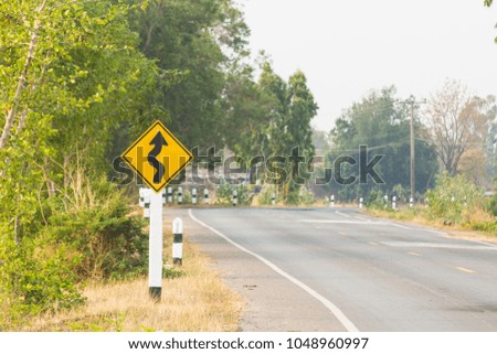 Traffic sign on a road in rural Thailand.