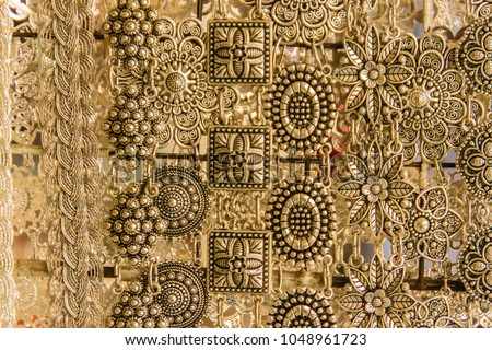Beautiful vintage silver belts pattern detailed in thai style fashion for women in the antique market. Shop for souvenir handcraft belt as vintage fashion for sale in a jewelry shop in Thailand. Royalty-Free Stock Photo #1048961723