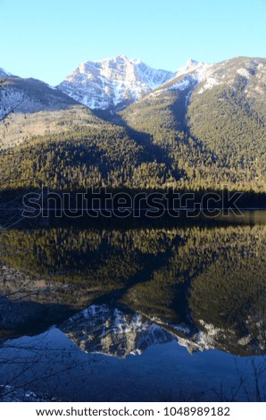 reflection of mountains in lake canada