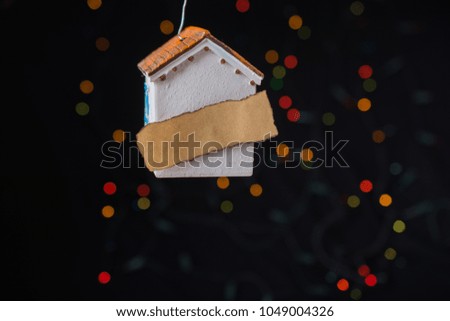 Little model house on a bokeh light background