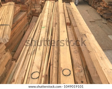 row stack of wood in storage warehouse