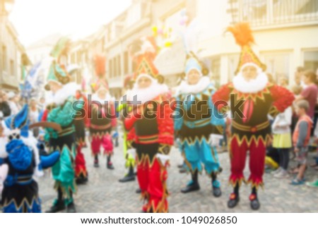 Blurry background colorful of carnival parade of the world, traditional festival present with man in beautiful costume and dance on street in parade at Stavelot ,Belgium,