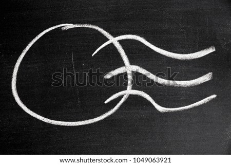 White chalk drawing in postmark shape on black board background