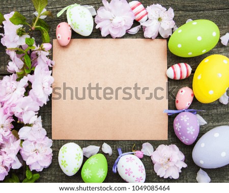 Easter eggs, spring sakura blossom and greeting card
