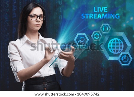 The concept of business, technology, the Internet and the network. A young entrepreneur working on a virtual screen of the future and sees the inscription: Live streaming