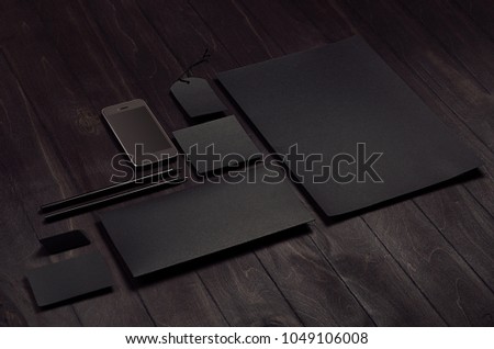 Premium dark black corporate identity template, stationery on black stylish wood background, inclined. Mock up for branding, graphic designers presentations and portfolios.