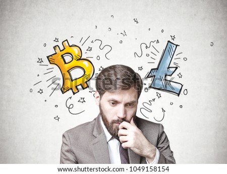 Young businessman with dark hair and a beard wearing a suit is thinking. A concrete wall background with a cryptocurrency sketch. Bitcoin Concept of doubt and choice in decision making