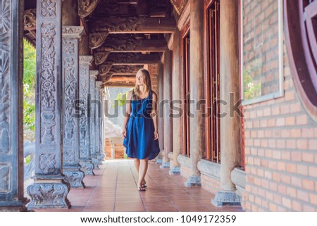 Young woman tourist in Pagoda. Travel to Asia concept. Traveling with a baby concept