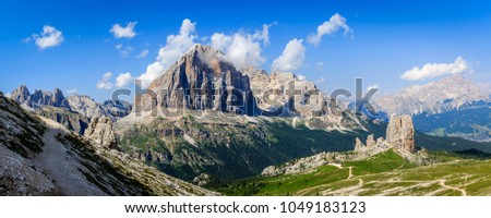 Great sunset view of the top Tofana di Rozes and Cinque Torri range in  Dolomites, South Tyrol. Location Cortina d'Ampezzo, Italy, Europe. Dramatical cloudy scene. Beauty of mountains world. Royalty-Free Stock Photo #1049183123