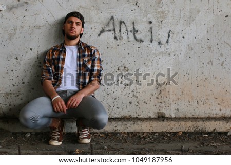 A young man with a bearded hip-hop dancer