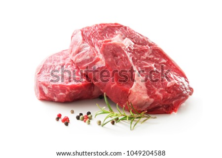 fresh raw rib eye steaks isolated on white background Royalty-Free Stock Photo #1049204588