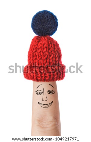 Hand-drawn face on finger isolated on white background