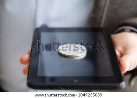 Hand holding smart phone with bitcoin concept on screen.