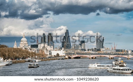 Landscape image view from Waterloo bridge along River Thames towards financial district in London
