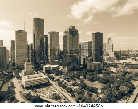 Aerial view Houston downtown and Gulf Freeway (highway I45). Daytime cityscape with cloud blue sky. Vintage tone.