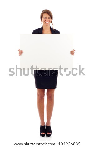 Full length portrait of a cute young woman holding a blank board isolated over white background