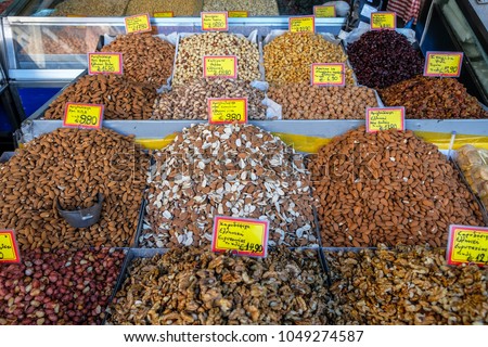 Assorted nuts for sale in the market with price signs written in Greek. Athens. Greece.