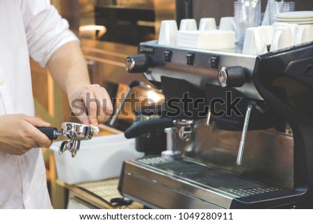 women's hands clean holder for coffee machine.
