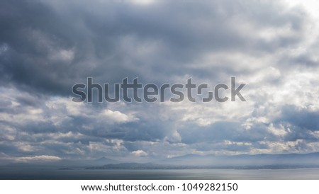 Outlines of dublin mountains with clouds, sky and sea