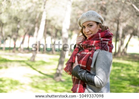 Pretty woman posing in the park for the photographer