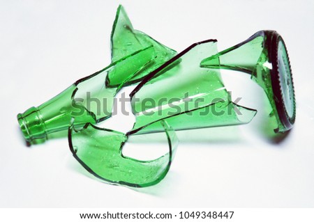 the broken green glass bottle on a white background Royalty-Free Stock Photo #1049348447