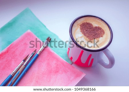 cappuccino with a heart pattern in the artist's workshop