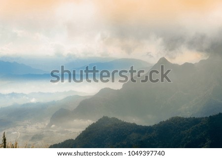 Landscape images of The mountains and mountain range are complicated On a cloudy day And the fog from the cold wind. Beautiful nature background 