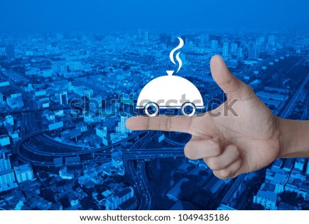 Restaurant cloche flat icon on finger over modern city tower, street and expressway, Food delivery concept